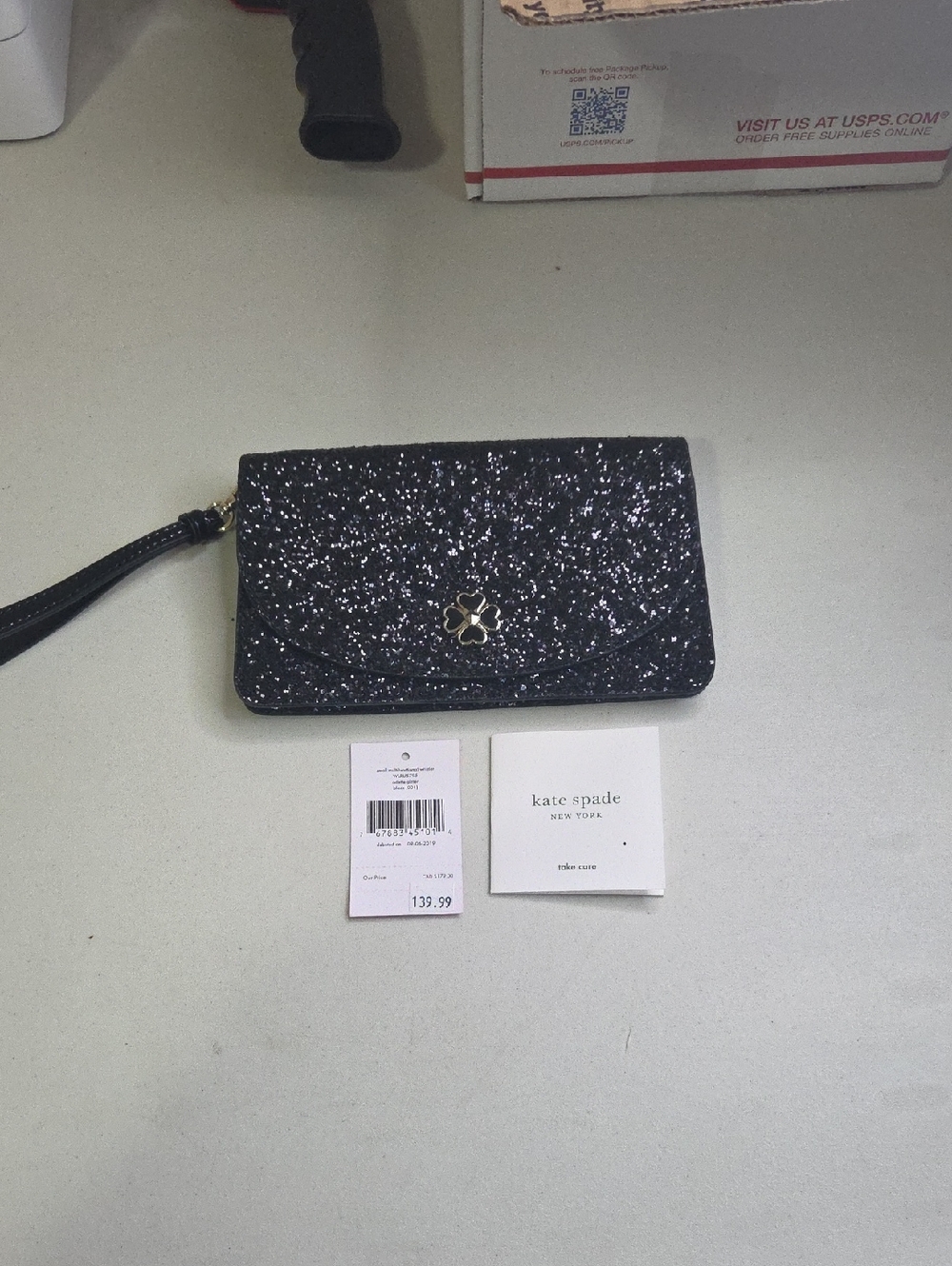 kate spade Black Glitter Wristlet Clutch with Floral Spade Logo